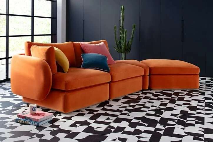 Ren Modular Sofa with wraparound curved arms in a modern living room