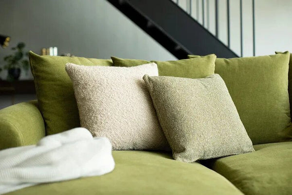 Teddy Chaise Lounge with deep seating and sculpted scroll arms upholstered in fabric