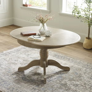 Julian Bowen Camille Round Extending Dining Table in Limed Oak – 110-145cm Extendable Pedestal Dining Table