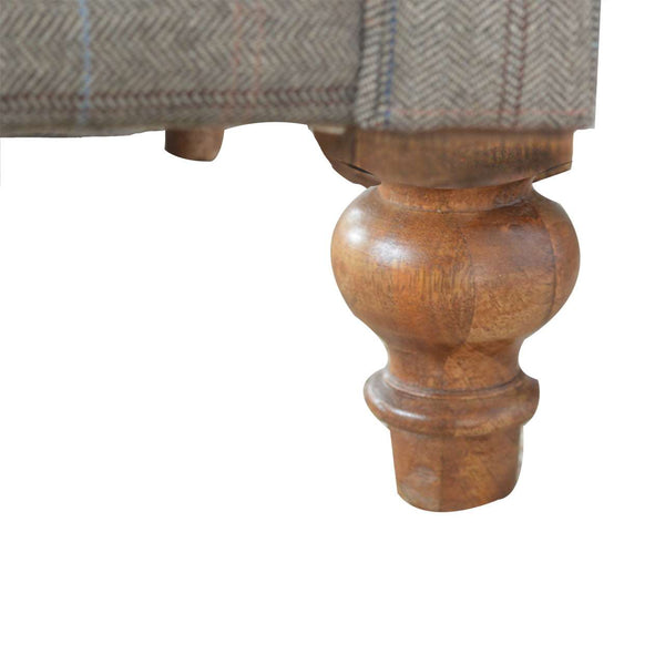 Close-up of deep button tufting on multi tweed Chesterfield sofa