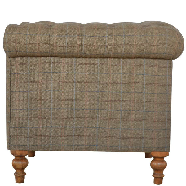 Multi tweed sofa showing sheltering arms and piped detailing