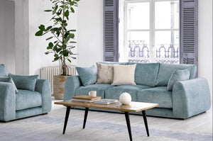 Carmel Contemporary Curved Sofa with sculptural design and plush cushions in modern living room