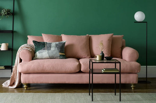 Teddy Sofa Bed in plush fabric with hardwood frame and feather cushions, convertible for seating and sleeping.