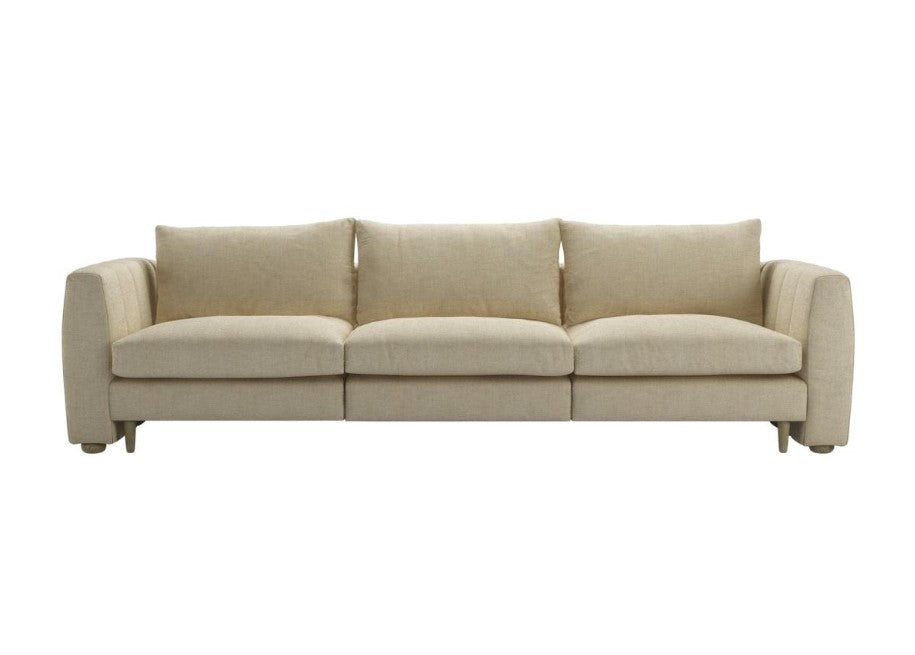 Tiffany luxury curved fabric sofa with feather cushions and elegant stitching details