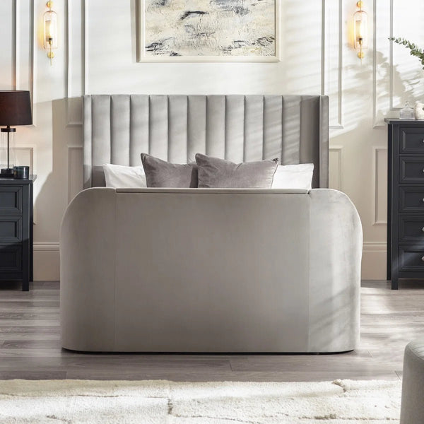Side view of Clara upholstered ottoman TV bed in light grey