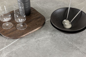 Härön Round Dining Table – Ribbed Dark Brown Base with Stone Top