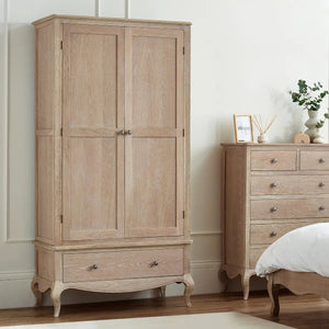 White combination wardrobe with doors and drawers for clothing storage