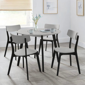 Julian Bowen round dining table with modern retro design