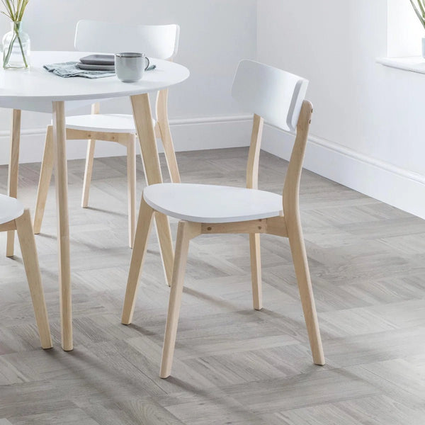 Julian Bowen Casa dining chairs showing compact Scandinavian-style design