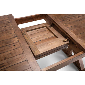 Reclaimed wood dining table showing detailed trestle legs