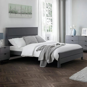 Storm grey wooden bed frame styled in a contemporary bedroom