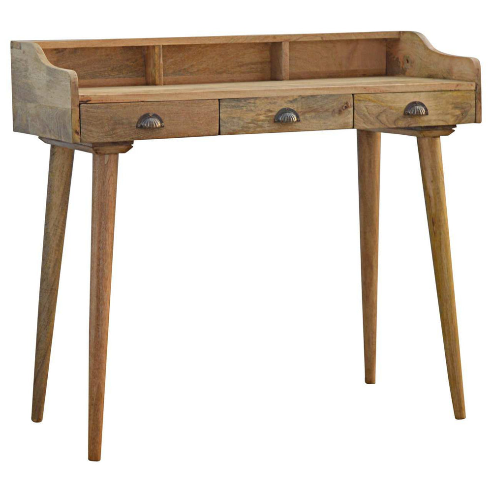 Gallery Back Shell writing desk made of solid mango wood with three drawers and a gallery back shelf.