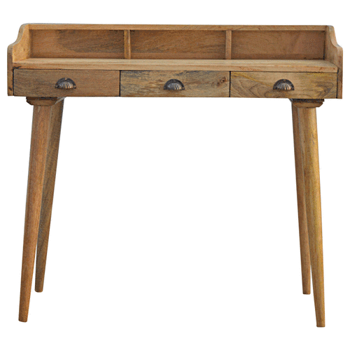 Gallery Back Shell writing desk made of solid mango wood with three drawers and a gallery back shelf.